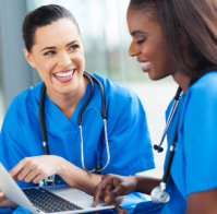 young female nurses having fun with laptop