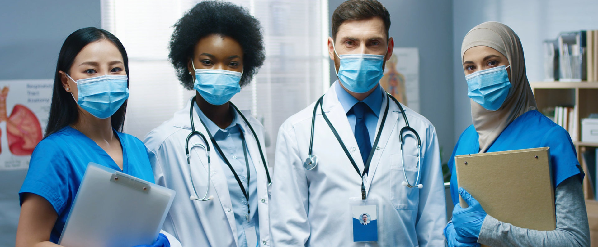 Portrait of happy young mixed-race doctors and nurses