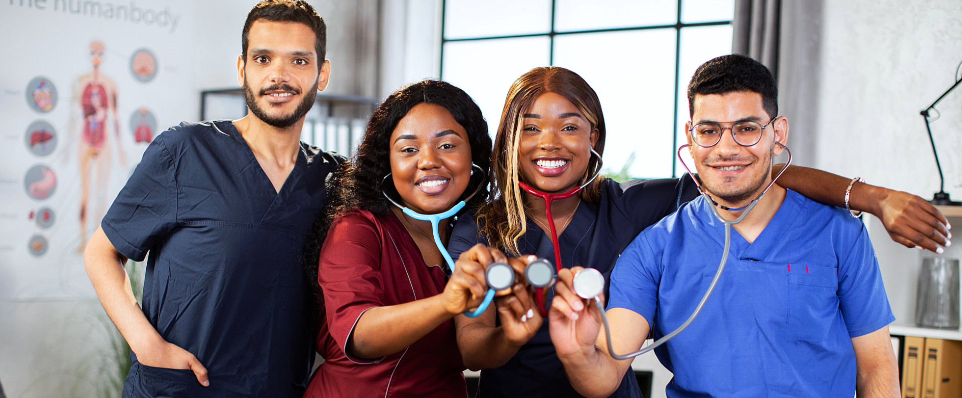 group of medical personnel posing with their stethoscope