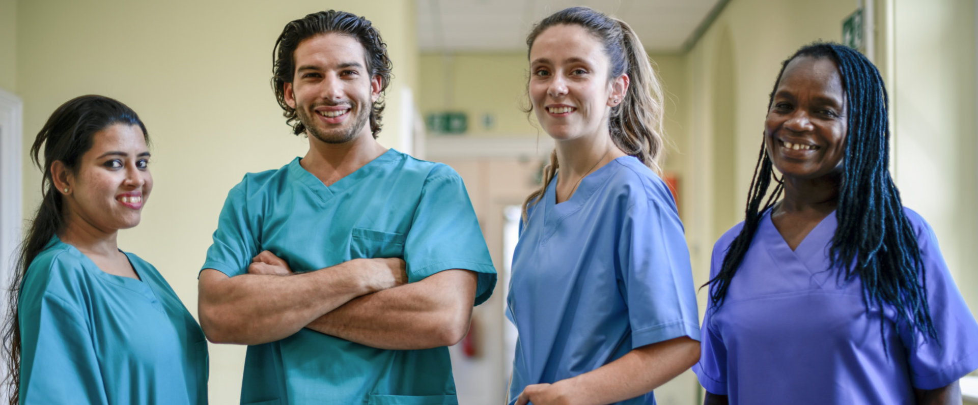 group of caregivers smiling at the camera